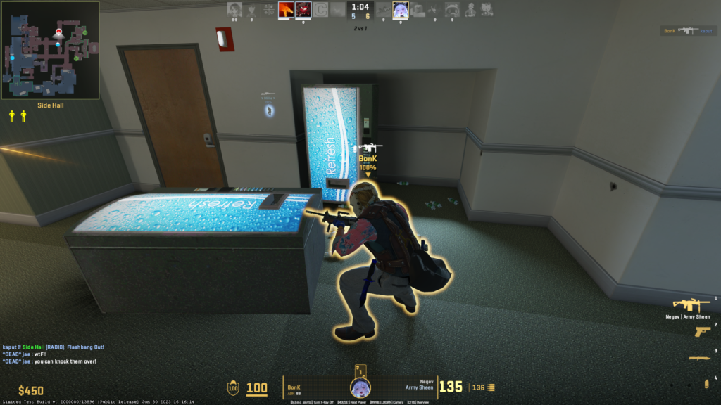 a T player standing behind a drink fridge knocked down in one of the Office corridors