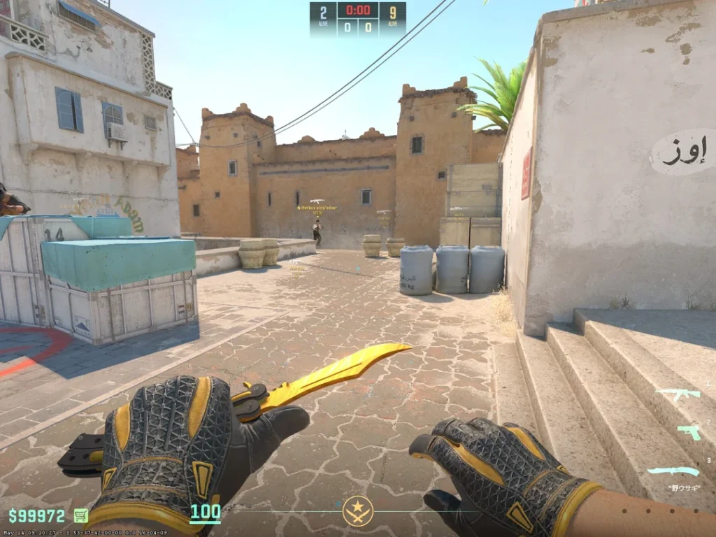 a person holding a golden butterfly knife in-game