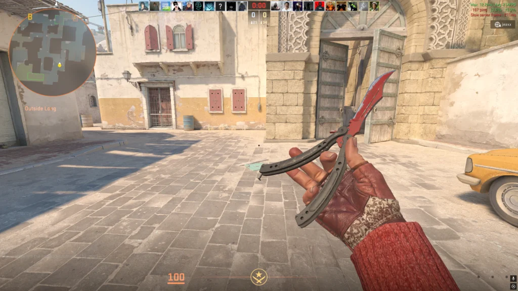 a person flipping one of the best CS2 knife skins and best knives in-game, the butterfly knife