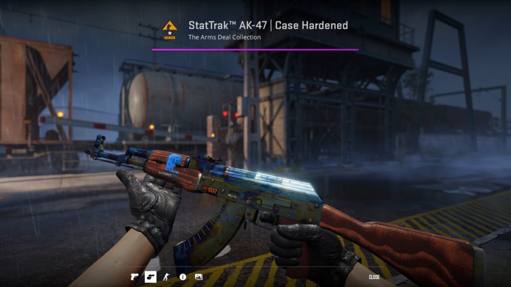 the Case Hardened version of the AK-47 being inspected in-game